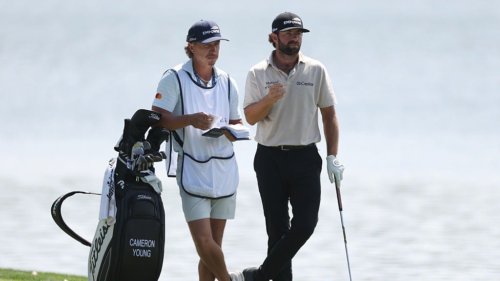  Cameron Young of the United States prepares to play a shot on the 17th hole alongside his caddie during the second round of THE PLAYERS Championship 2026 at THE PLAYERS Stadium course at TPC Sawgrass on March 13, 2026 in Ponte Vedra Beach, Florida. (Photo by Richard Heathcote/Getty Images)