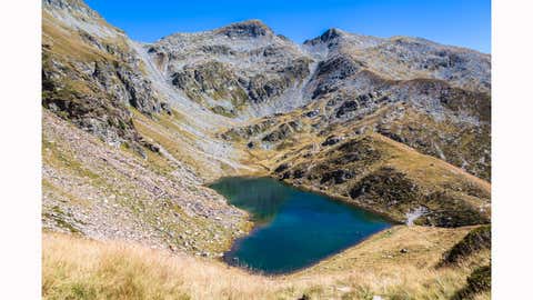 Located about 7,000 feet up the Calanca Mountain Trail between the Calanca and Mesolcina Valleys in the Swiss Alps, Lake Calvaresc is a stunning pool of water surrounded by scenic mountains views. (VogelSP/Getty Images)