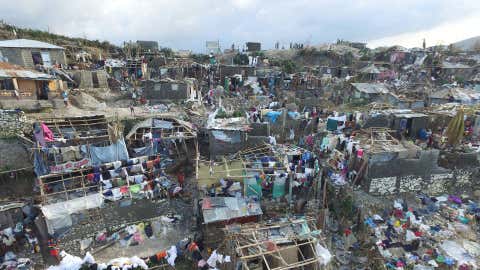 Homes destroyed and damaged by Hurricane Matthew are seen in Jeremie, in western Haiti, on October 7, 2016. The full scale of the devastation in hurricane-hit rural Haiti became clear as the death toll surged over 400, three days after Hurricane Matthew leveled huge swaths of the country's south. (Nicolas Garcia/AFP/Getty Images)