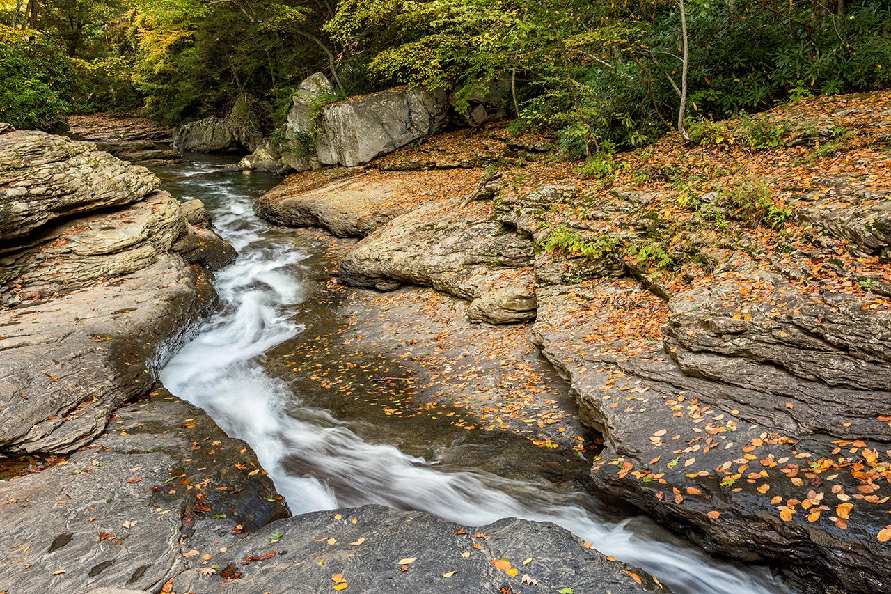 The natural water slide in Ohiopyle State Park in western Pennsylvania is also know as The Flume. In this photograph the rushing water can be seen in the channel it has cut into rock over the years during the fall. During the hot summer months, people line up to take the ride. (Howard Grill via Getty Images)