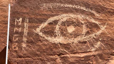 Vandals scratched a drawing of an eye and the letters M, M, G, B in a monolith at the Temple of the Moon in Capitol Reef National Park's Cathedral Valley in south-central Utah. (Capitol Reef National Park)