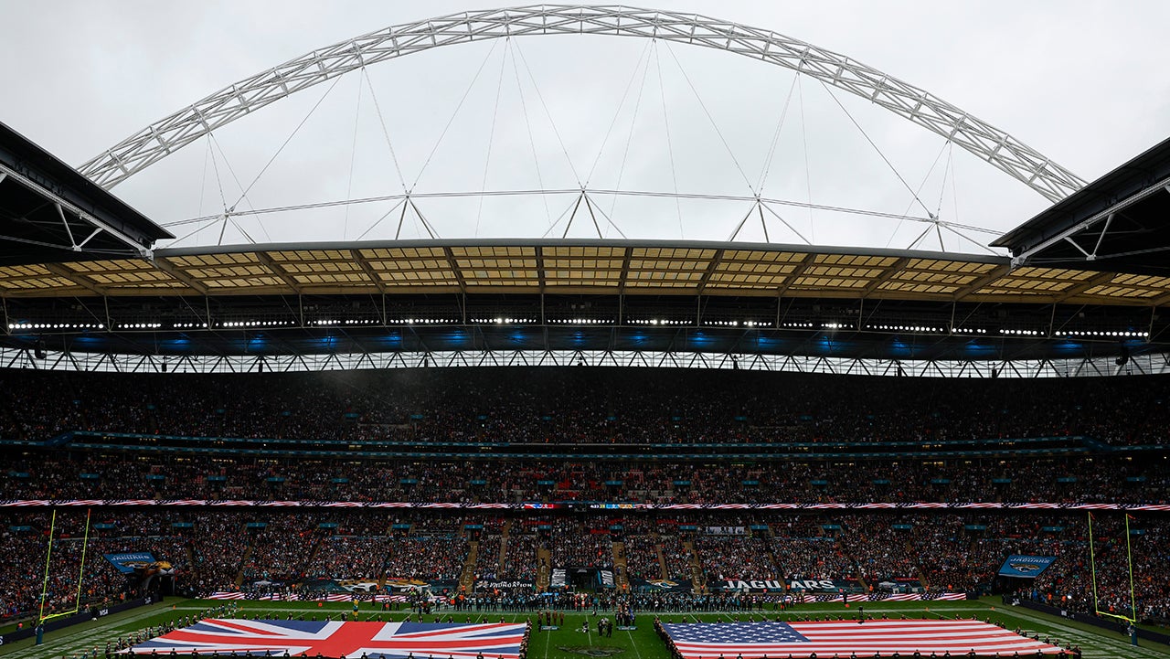 London, England - October 20: The flags of the United States and Great Britain are displayed on the field before the New England Patriots face the Jacksonville Jaguars at Wembley Stadium. (Photo by Danielle Parhizkaran/The Boston Globe via Getty Images)