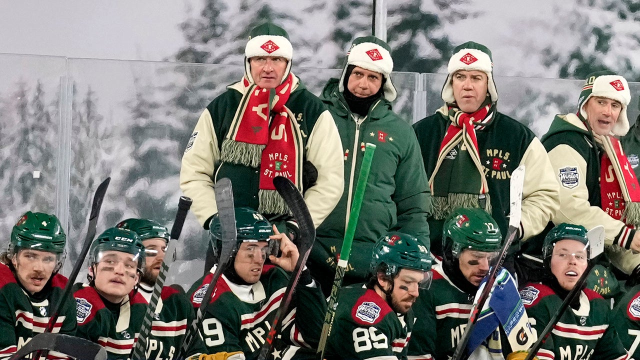 MINNEAPOLIS, MINNESOTA - JANUARY 01: Head coach Dean Evason of the Minnesota Wild and staff stands on the bench during the 2022 NHL Winter Classic between the St. Louis Blues and the Minnesota Wild at Target Field on January 01, 2022 in Minneapolis, Minnesota. (Photo by Patrick McDermott/NHLI via Getty Images)