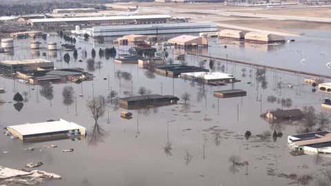 Floodwaters have covered about a third of Offutt Air Force Base in Bellevue, Nebraska, south of Omaha. About 3,000 feet of runway also has been flooded. (55th Wing Commander/Facebook)