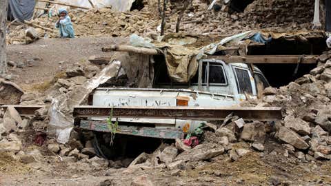 An Afghan villager sits near his damaged house that was destroyed in an earthquake in the Spera District of the southwestern part of Khost Province, Afghanistan, Wednesday, June 22, 2022. A powerful earthquake struck a rugged, mountainous region of eastern Afghanistan early Wednesday, killing at least 1,000 people and injuring 1,500 more in one of the country's deadliest quakes in decades, the state-run news agency reported. (AP Photo)