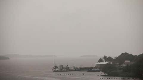 The sky is overcast due to Tropical Storm Bonnie in Bluefields, Nicaragua, Friday, July 1, 2022. Tropical Storm Bonnie has formed over the Caribbean as it heads for a quick march across Central America and potential development into a hurricane after reemerging in the Pacific.  (AP Photo/Inti Ocon)