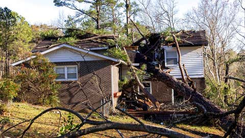 Wes Garner's residence is damaged by fallen trees which also destroyed his shed and caused a gas leak following from Tuesday night's severe weather, Wednesday, Nov. 30, 2022, in Eutaw, Ala. (AP Photo/Vasha Hunt)