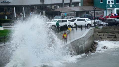 A city worker views a wave crashing along a walkway during storm Lee,Saturday,Sept. 16,2023,in Bar Harbor,Maine. (AP Photo/Robert F. Bukaty)