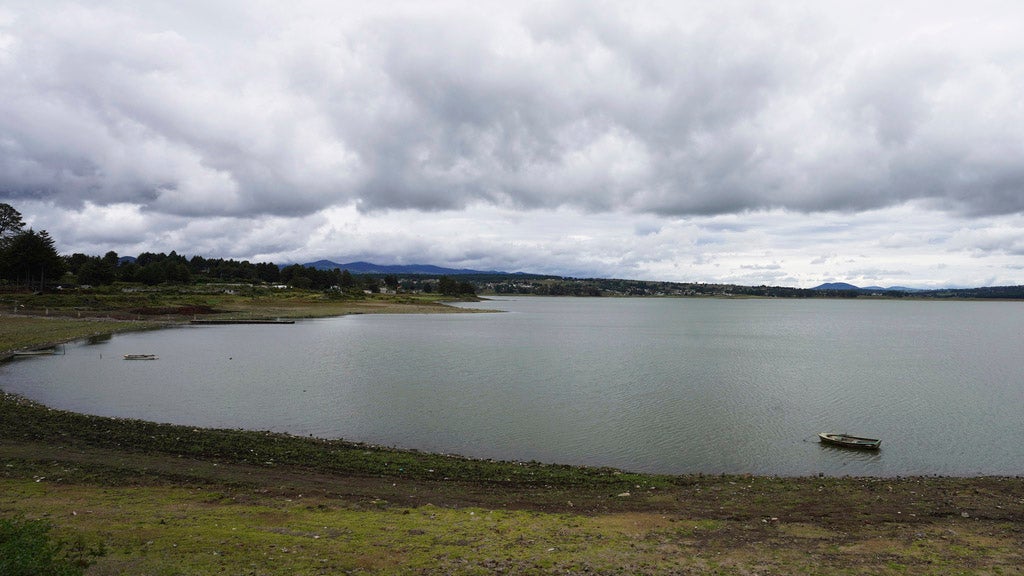 The banks of the Villa Victoria reservoir are exposed in the the State of Mexico, Tuesday, Oct. 10, 2023. The capital’s reservoirs like Villa Victoria are running historically low following a “too dry” summer, according to official data, and as the rainy season draws to a close, water restrictions have already begun. (AP Photo/Marco Ugarte)