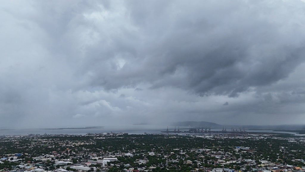 Clouds cover Kingston, Jamaica, ahead of the forecast arrival of Hurricane Melissa on Sunday, Oct. 26, 2025. (AP Photo/Matias Delacroix)