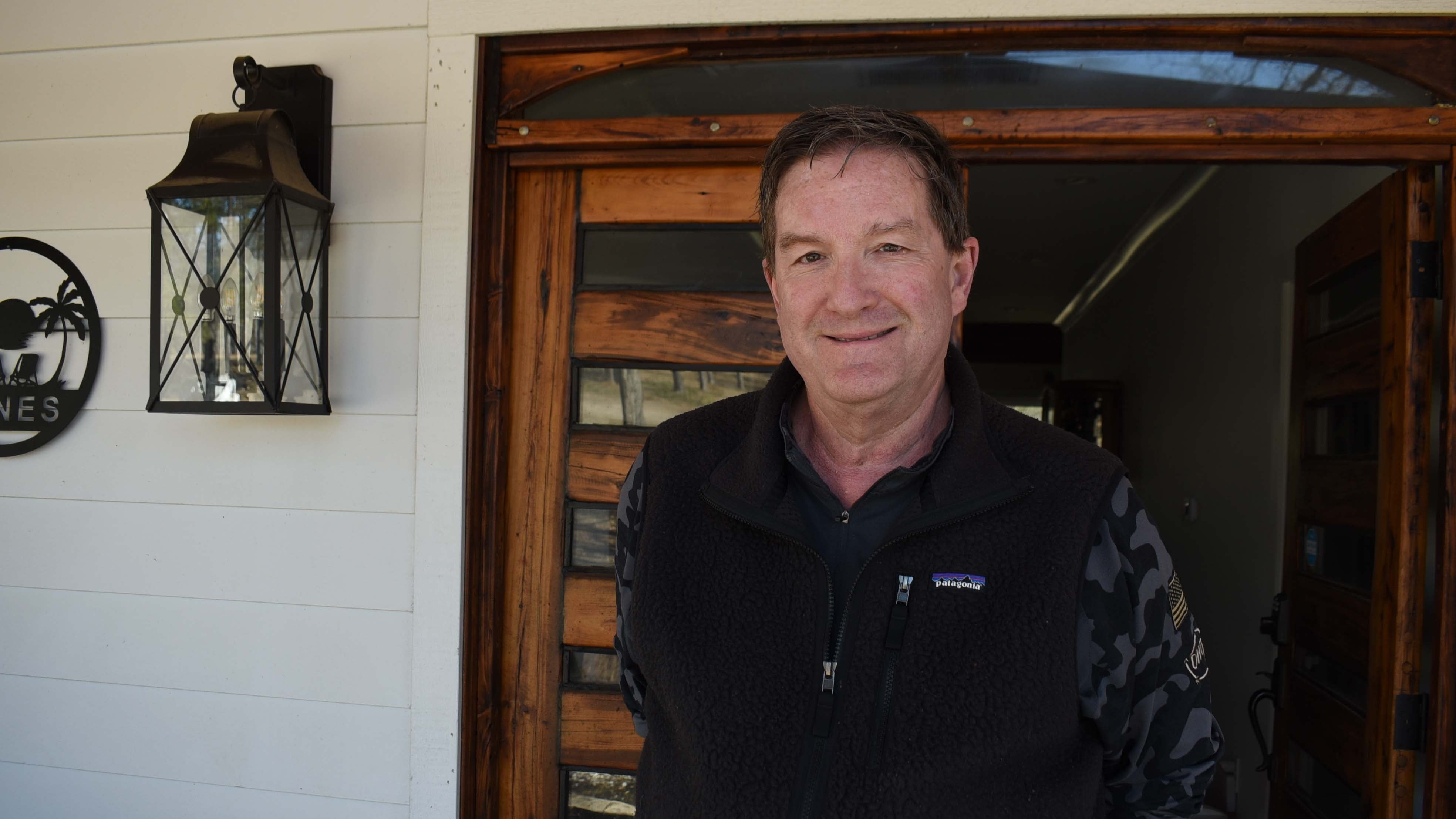 Russ Jones, whose home has not had power in 13 days, stands on his front porch on Friday, Feb. 6, 2026 in Oxford, Ms. (AP Photo/Sophie Bates)