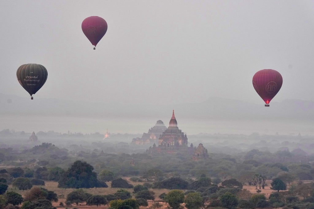 Hot air balloons fly over Myanmar's ancient temples just before the sunrise in old Bagan, Nyaung U district, central Myanmar, Tuesday, Feb. 17, 2026. (AP Photo/Aung Shine Oo)