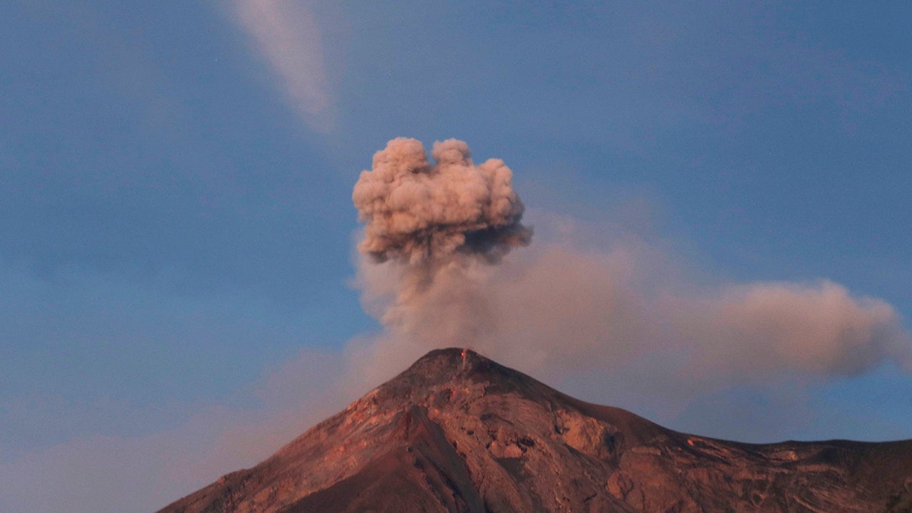 The Volcan de Fuego, or Volcano of Fire, spews a plume of ash as seen from San Juan Alotenango, Guatemala, Tuesday, Nov. 20, 2018. The volcanology institute reported that activity subsided Monday evening. Hundreds of families who heeded the call of disaster coordination authorities to evacuate 10 communities began returning to their homes Tuesday. (AP Photo/Moises Castillo)