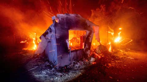 Flames from the LNU Lightning Complex fires consume a home in unincorporated Napa County, Calif., on Wednesday, Aug. 19, 2020. Fire crews across the region scrambled to contain dozens of wildfires sparked by lightning strikes. (AP Photo/Noah Berger)