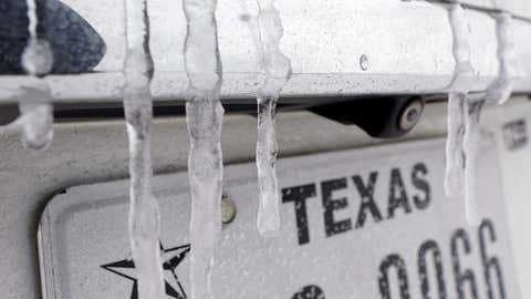 Icicles hang on the back of a vehicle Monday, Feb. 15, 2021, in Houston. A frigid blast of winter weather across the U.S. plunged Texas into an unusually icy emergency Monday that knocked out power to more than 2 million people and shut down grocery stores and dangerously snowy roads. (AP Photo/David J. Phillip)