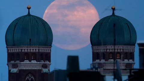 The full moon rises behind the Church of Our Lady in Munich, Germany on Sunday, March 28, 2021. The full moon from March to March is called the "Worm Moon." (AP Photo / Matthias Schrader)