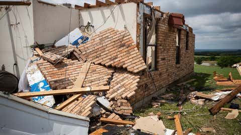 At the Brazos wedding site, a lodge in the barn can be seen after it was destroyed by a tornado on Tuesday, May 4, 2021, at Blum, Texas. (Yffy Yossifor / Star-Telegram via AP)