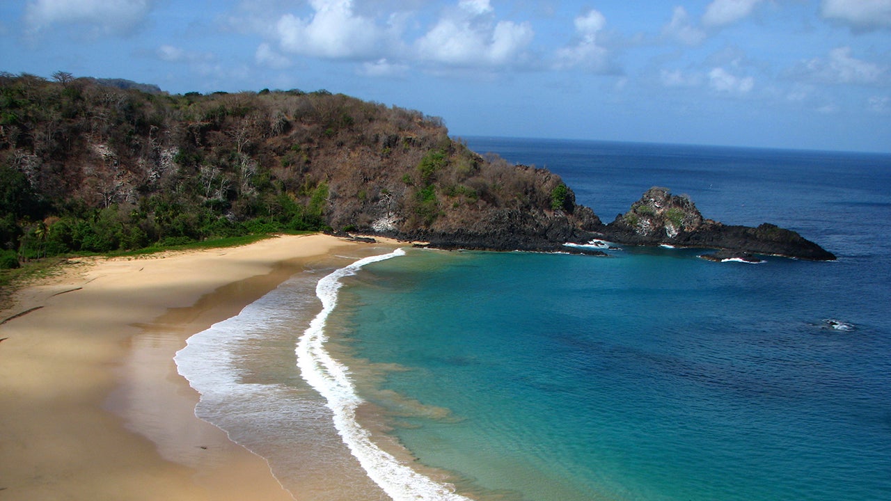 Baia do Sancho is located on a an island to the northeast of the Brazilian mainland. Trekkers have quite the adventure to get to this beach, including a rickety ladders, a tight crevasse, a rock wall and slippery steps. (Mauro Nogueira Images via Getty Images)