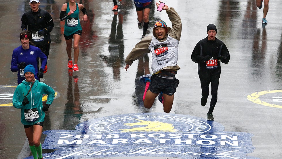 Yuichiro Hidaka kicks his heels as he approaches the finish line of the 122nd Boston Marathon, April 16, 2018.