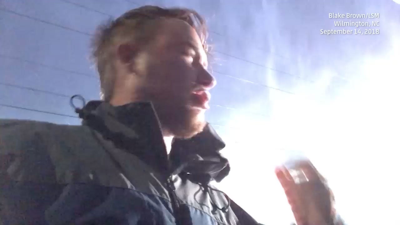 Sparking Power Lines Send Storm Chaser Running In