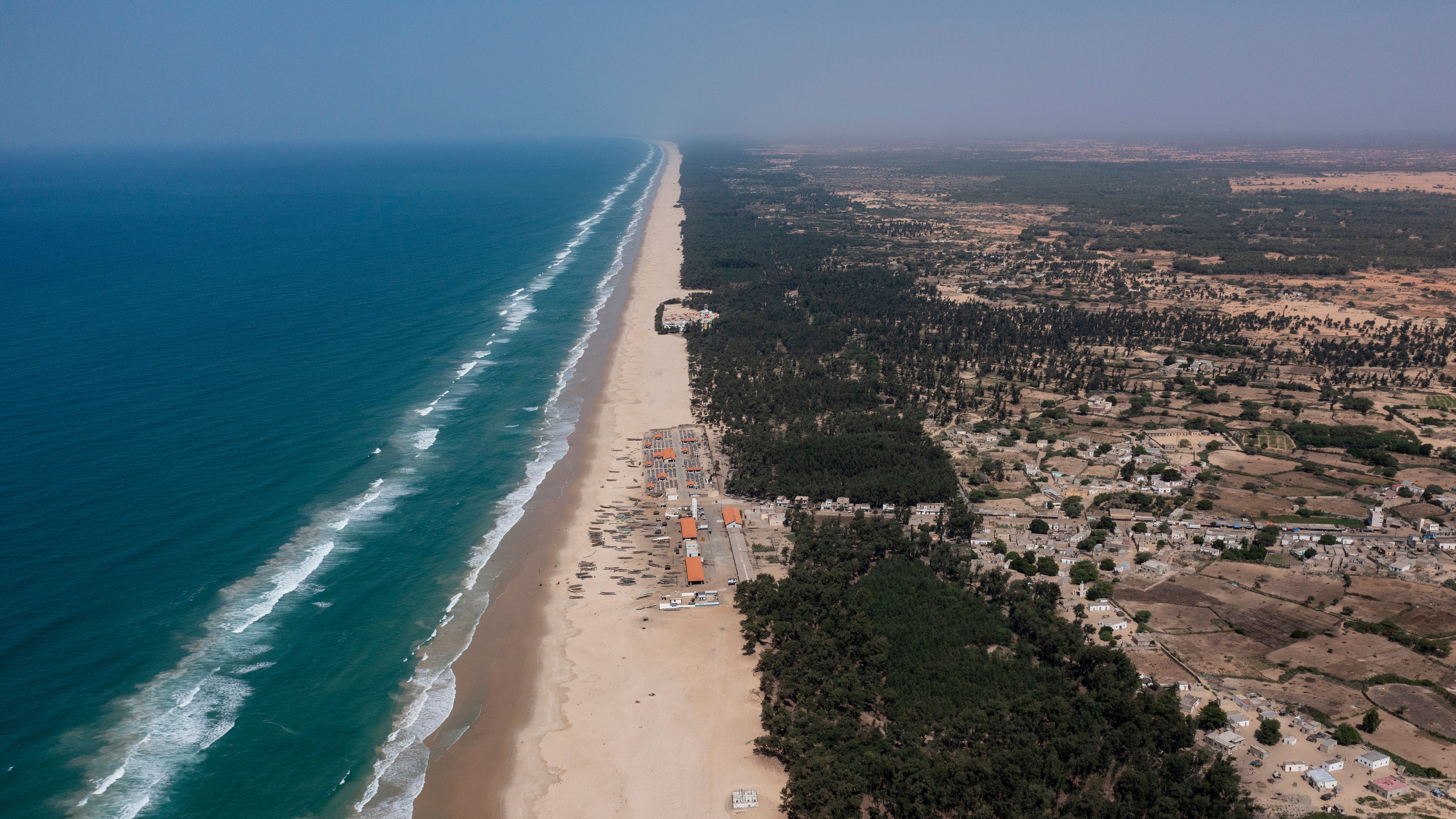 FILE - Filao trees form a curtain that protects the beginning of the Great Green Wall, planted to slow coastal erosion along the Atlantic Ocean, in Lompoul village near Kebemer, Senegal, Nov. 5, 2021. A series of complex challenges, including a lack of funding and political will as well as rising insecurity linked to extremist groups al-Qaida and the Islamic State in Burkina Faso, are obstructing progress on Africa's Great Green Wall, according to experts involved in the initiative. (AP Photo/Leo Correa, File)