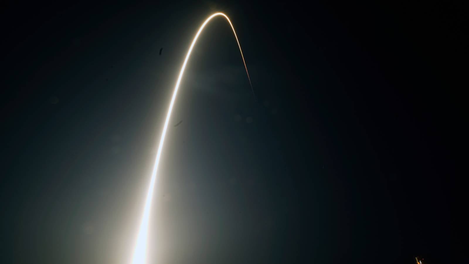 FILE - In this time-exposure photograph, a SpaceX Falcon 9 rocket with the 25th batch of approximately 60 satellites for SpaceX's Starlink broadband network lifts off from the Space Launch Complex 40 at the Cape Canaveral Space Force Station in Cape Canaveral, Fla., late Wednesday, April 28, 2021. (AP Photo/John Raoux, File)