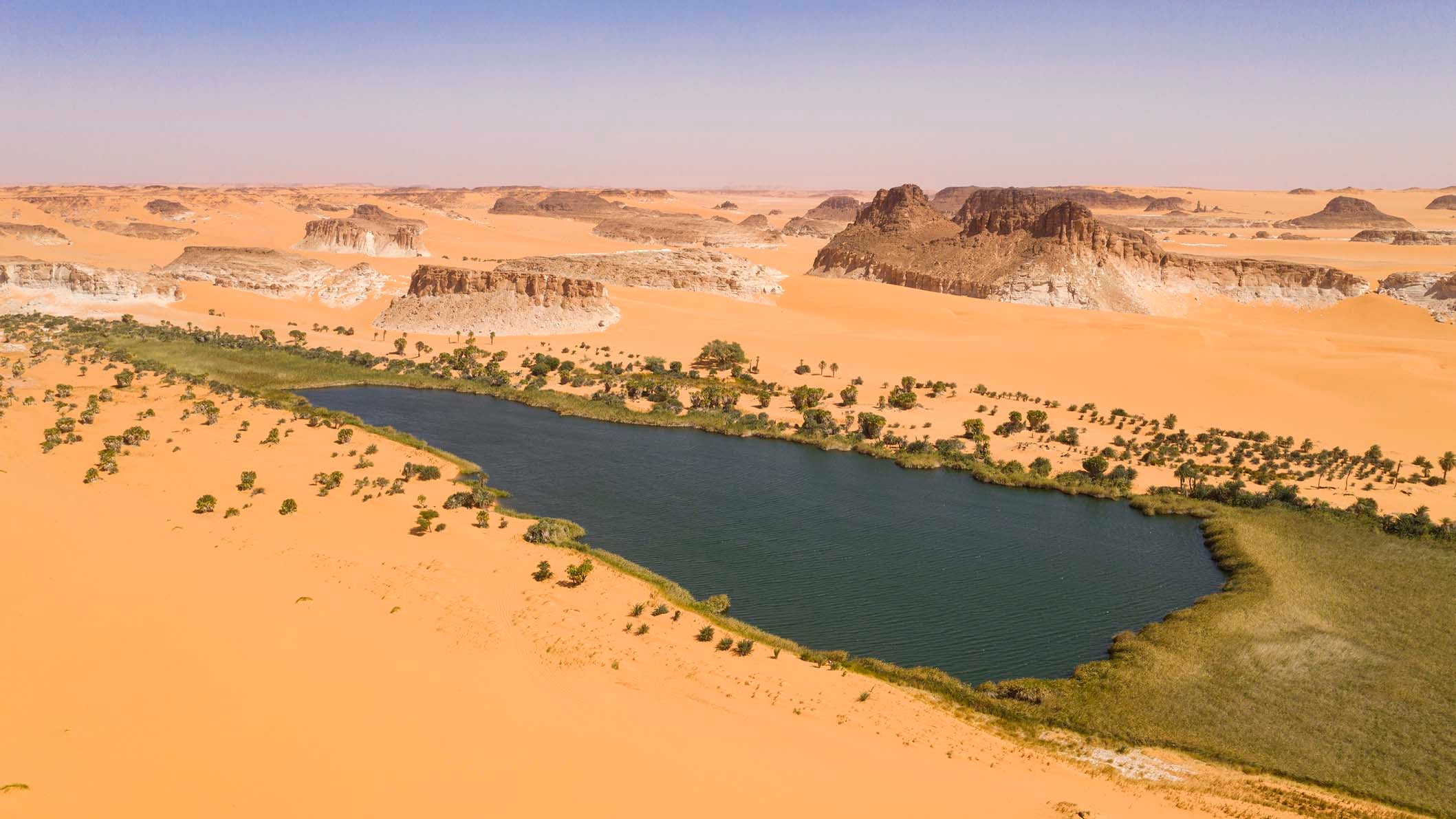 Aerial view of the Ounianga S&eacute;rir Lake, one of the legendary Lakes of Ounianga in North-Eastern Chad. These remote lakes are definetely one of the greatest natural wonders on our planet. In the middle of the endless Sahara Desert, actually in a basin between the  mountains of Western Tibesti and the Eastern Ennedi massif there is a total of 18 lakes. All togehter the lakes are covering a surface of approx. 20 square kilometers. The Lakes of Ounianga were declared as an UNESCO World Heritage site in 2012.