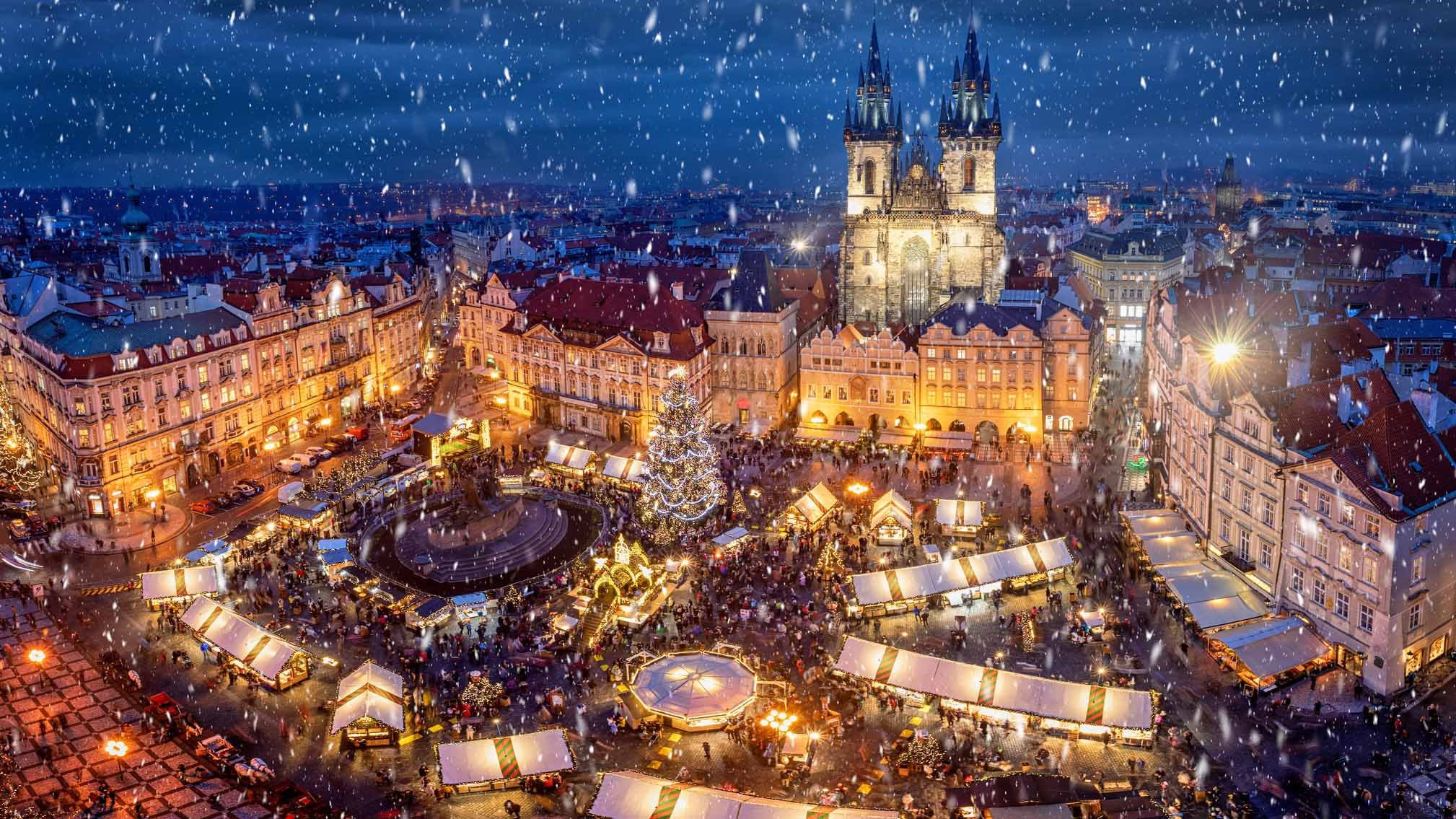 View of the old town square of Prague, Czech Republic, during winter time with the traditional Christmas Market under snow