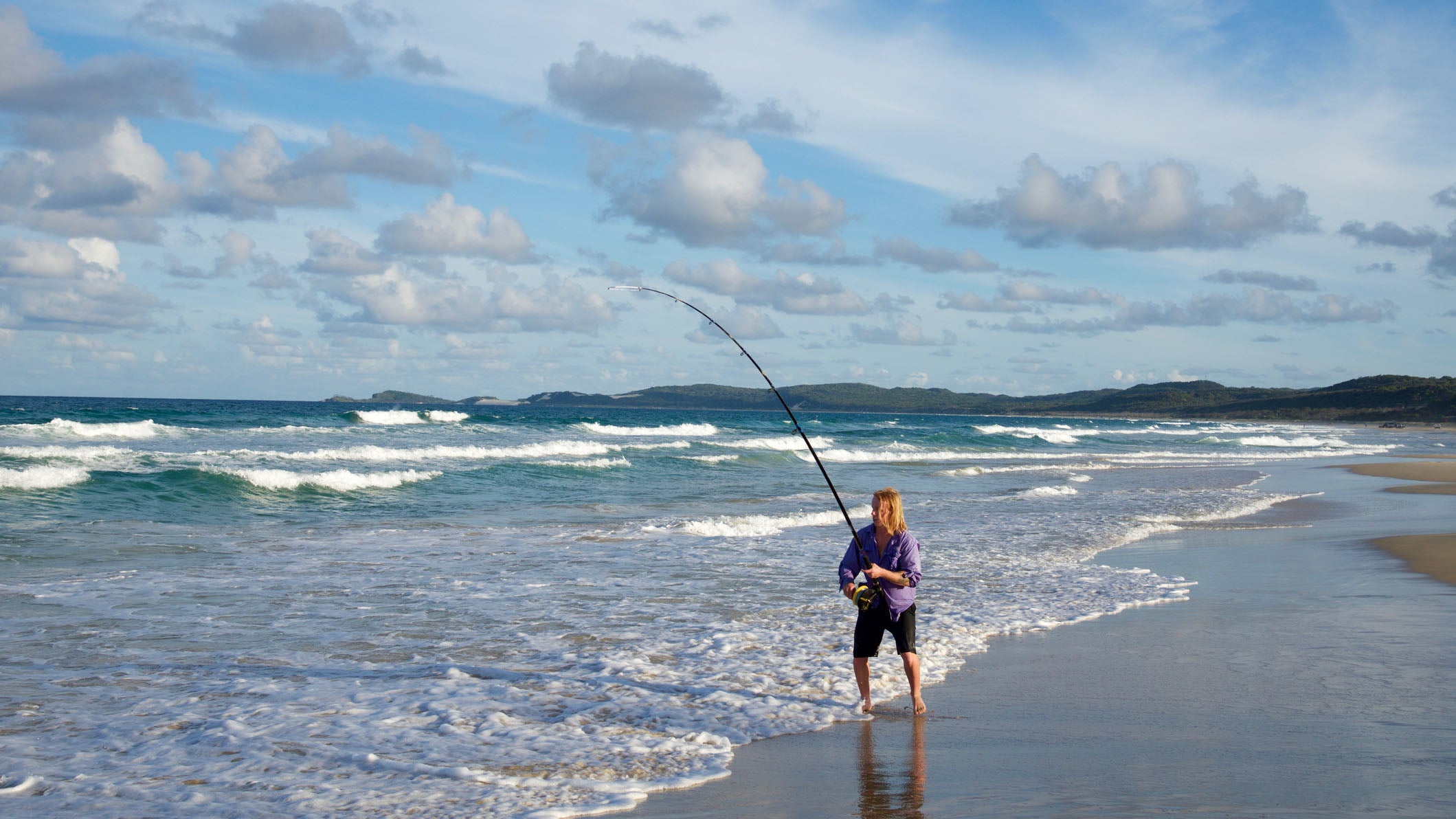 Beach fishing at sunset onFraser island, nature reserve in Australia
