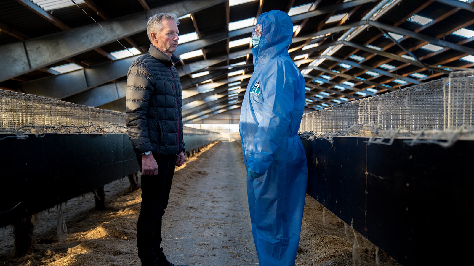 Mink breeder Peter Hindbo, left, talks with Denmark's Prime Minister Mette Frederiksen, right, during a visit to a closed mink farm near Kolding, Denmark, Thursday Nov. 26, 2020. (Mads Nissen/Ritzau Scanpix via AP)
