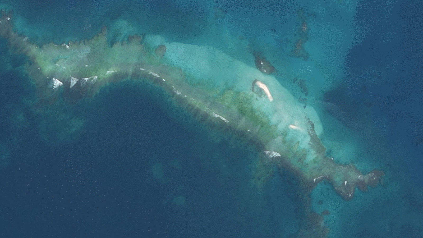 This satellite image shows East Island in the French Frigate Shoals under water after Hurricane Walaka. The same hurricane decimated a coral reef in the region. (U.S. Fish and Wildlife Service)
