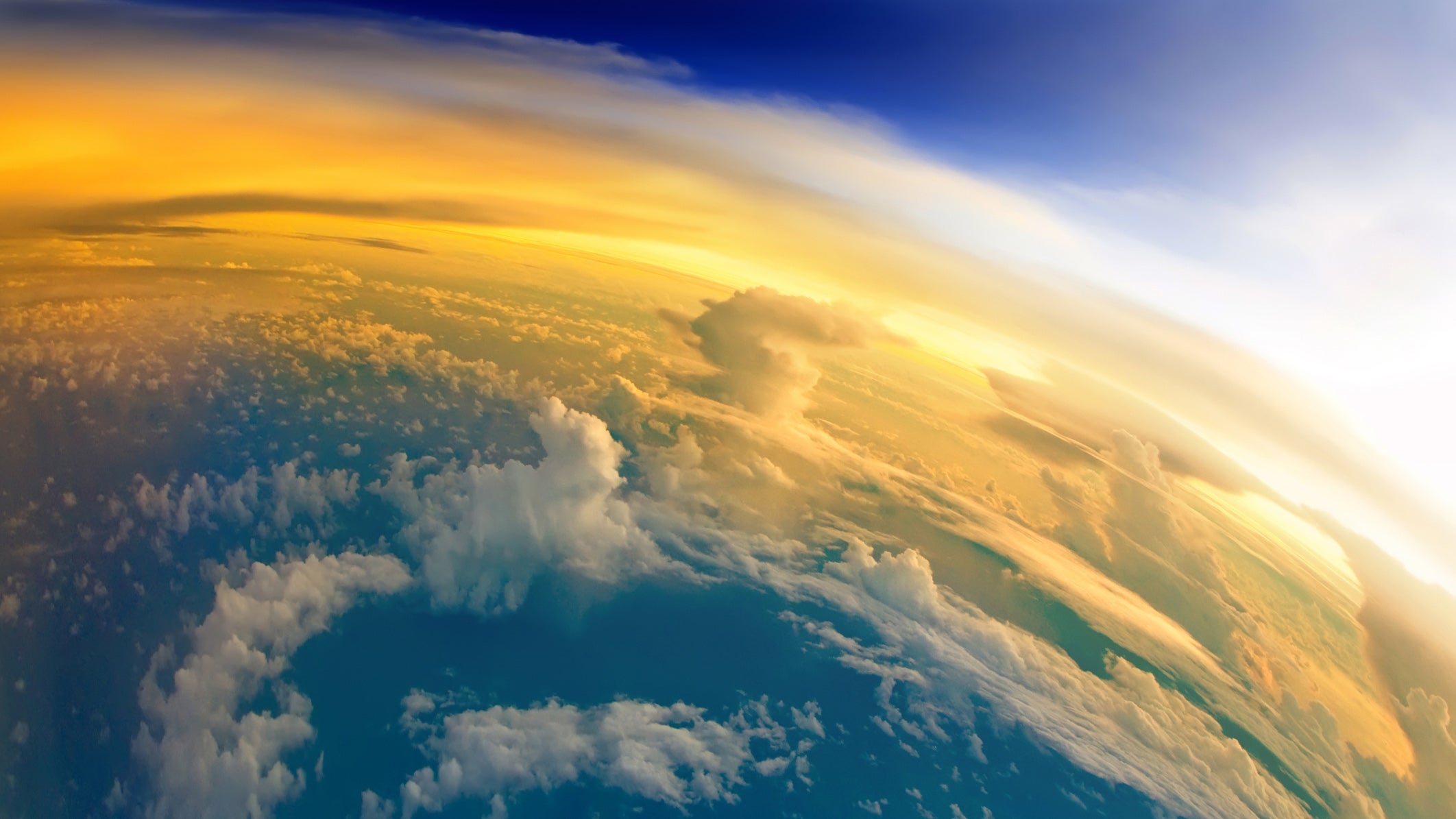 "Aerial view of Planet Earth with clouds, horizon and little bit of space, make feelings of being in heaven. Dramatic clouds and orange sunlight all over the planet. Cloudscape and stratosphere from above at 30000 feet.See more images like this in:"