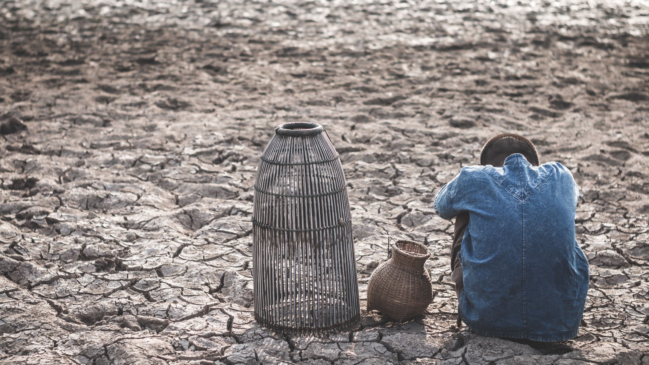 The cracked dry ground due to drought, food shortages and water,  Concept drought and crisis environment.