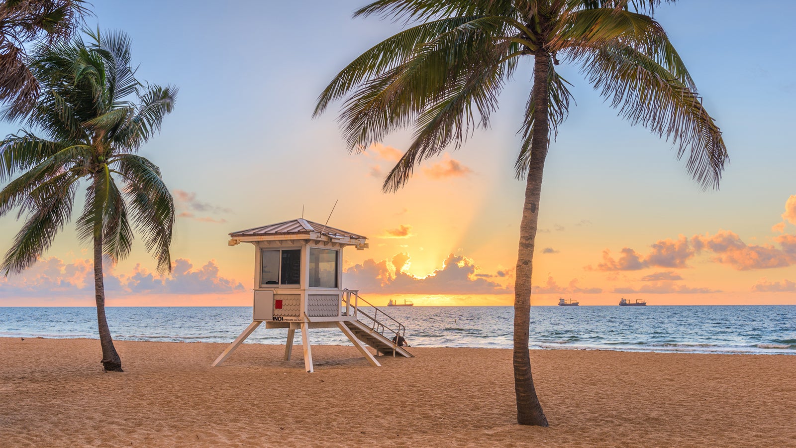 Fort Lauderdale, Florida, USA beach and life guard tower at sunrise.