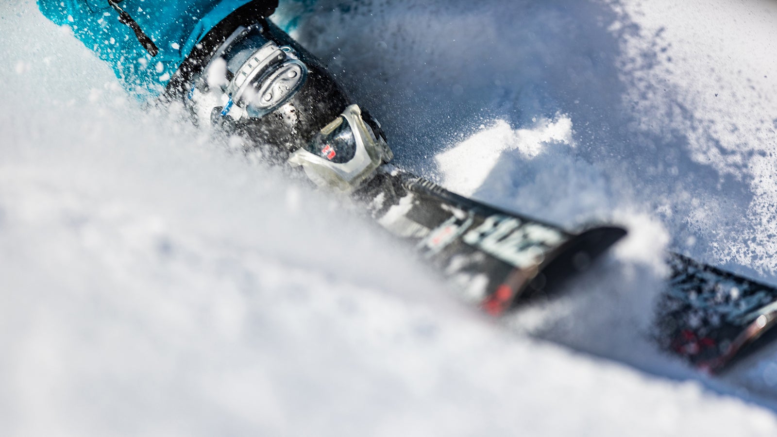Close up of unrecognizable person skiing on snow. Copy space.