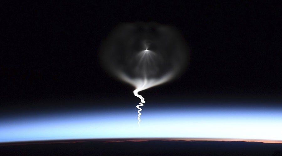 This photo provided by NASA astronaut Christina Koch shows the launch of a Russian Soyuz rocket, as seen from the International Space Station, during its approach on Wednesday, Sept. 25, 2019. (Christina Koch/NASA via AP)