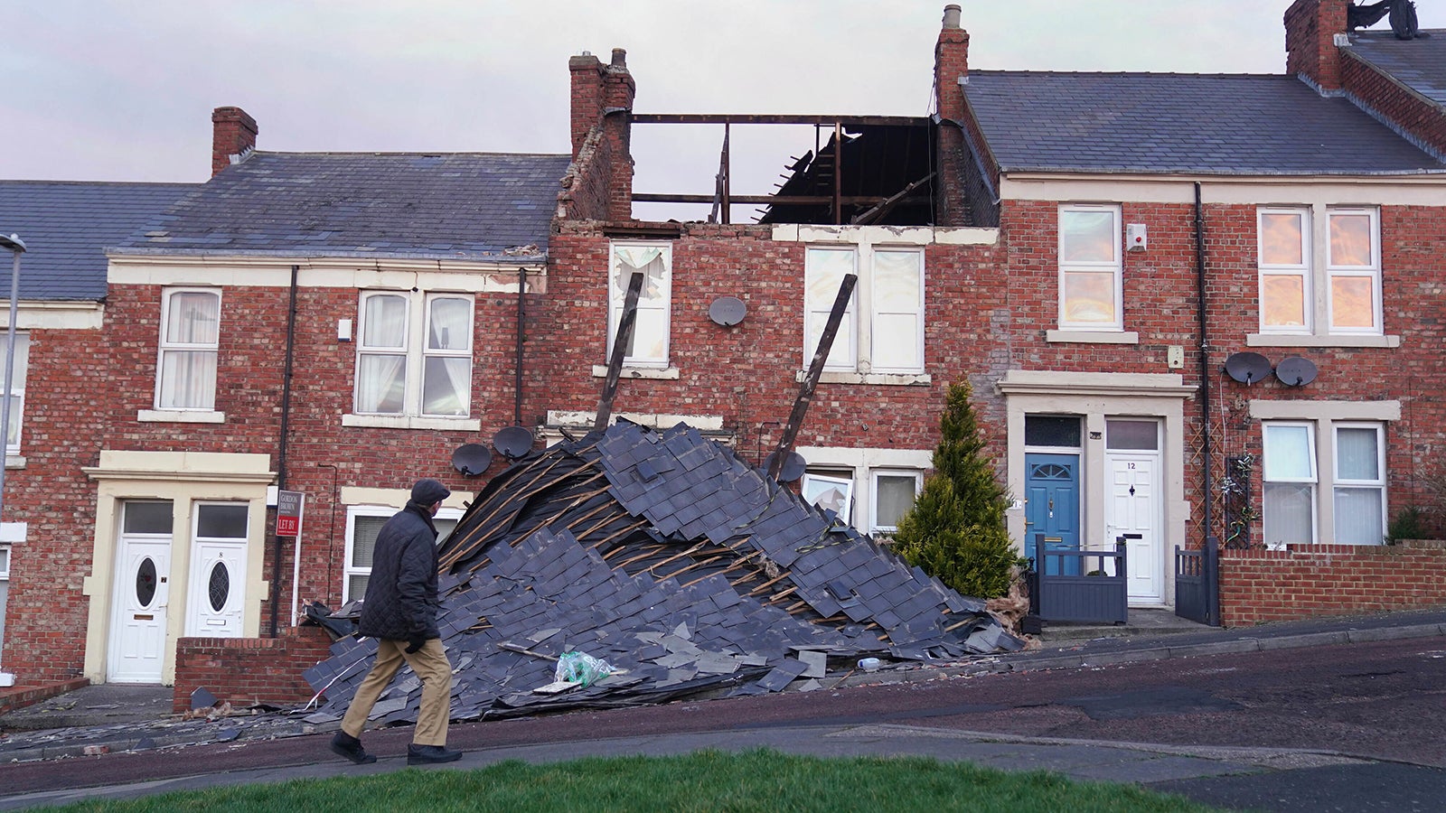 A house in Gateshead, north east England, Sunday Jan. 30, 2022, which lost its roof after strong winds from Storm Malik battered northern parts of the UK PA Photo. The Met Office have said that another blast of severe strong winds is set to hit parts of the UK. (Owen Humphreys/PA via AP)