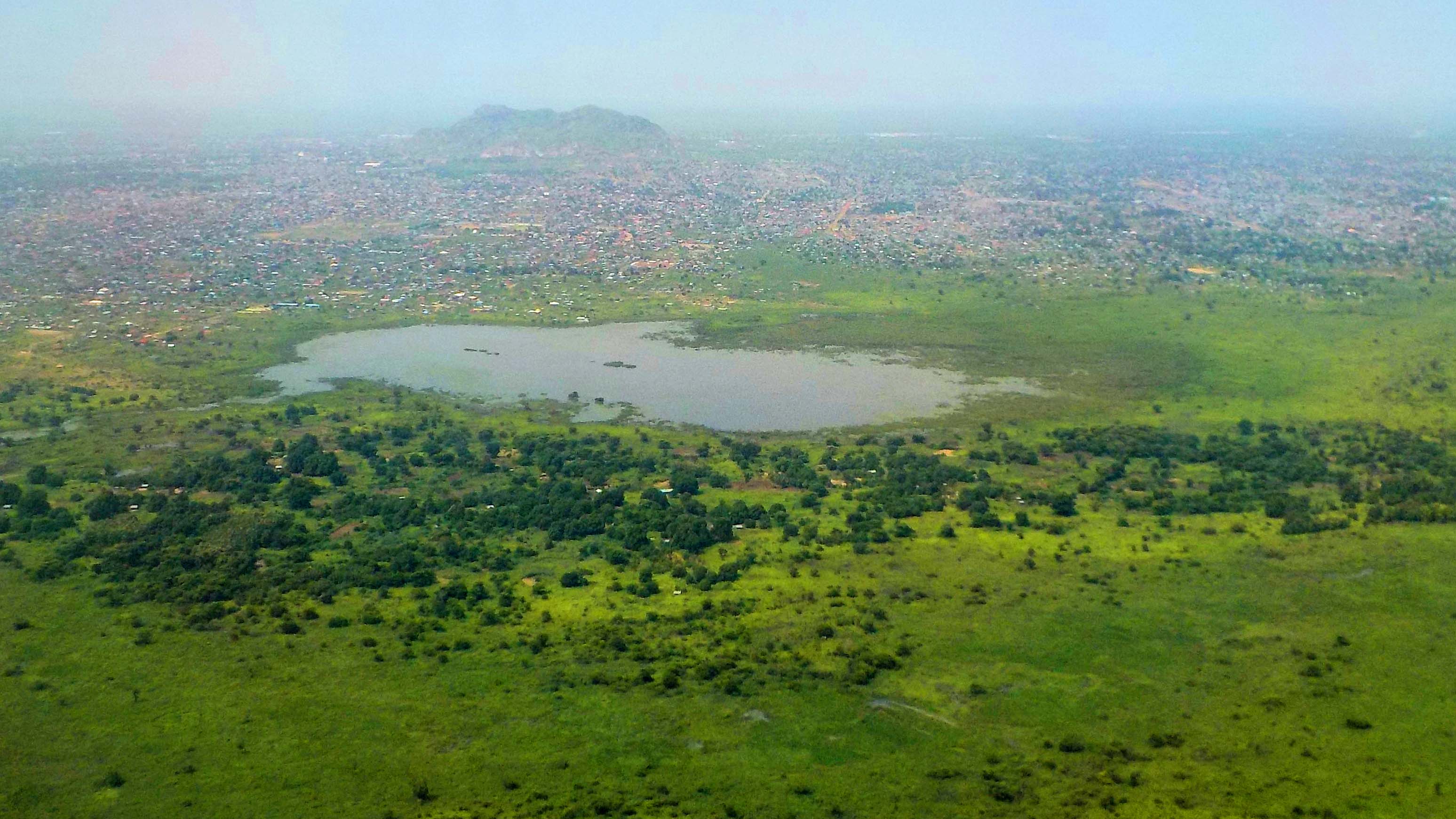 Juba, South Sudan: Africa's newest capital seen from the air - lake and mountain - White Nile in the background