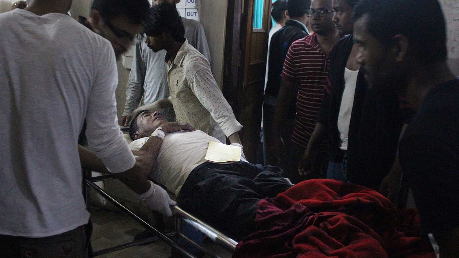 An Injured of rain storm from Bara district is being brought to a government hospital, in Birgunj, 136 kilometers (85 miles) from Kathmandu, Nepal, March 31, 2019. Officials say many people were killed and hundreds were injured by a rainstorm that swept southern Nepal on Sunday. (AP Photo/Jiyalal Sah)
