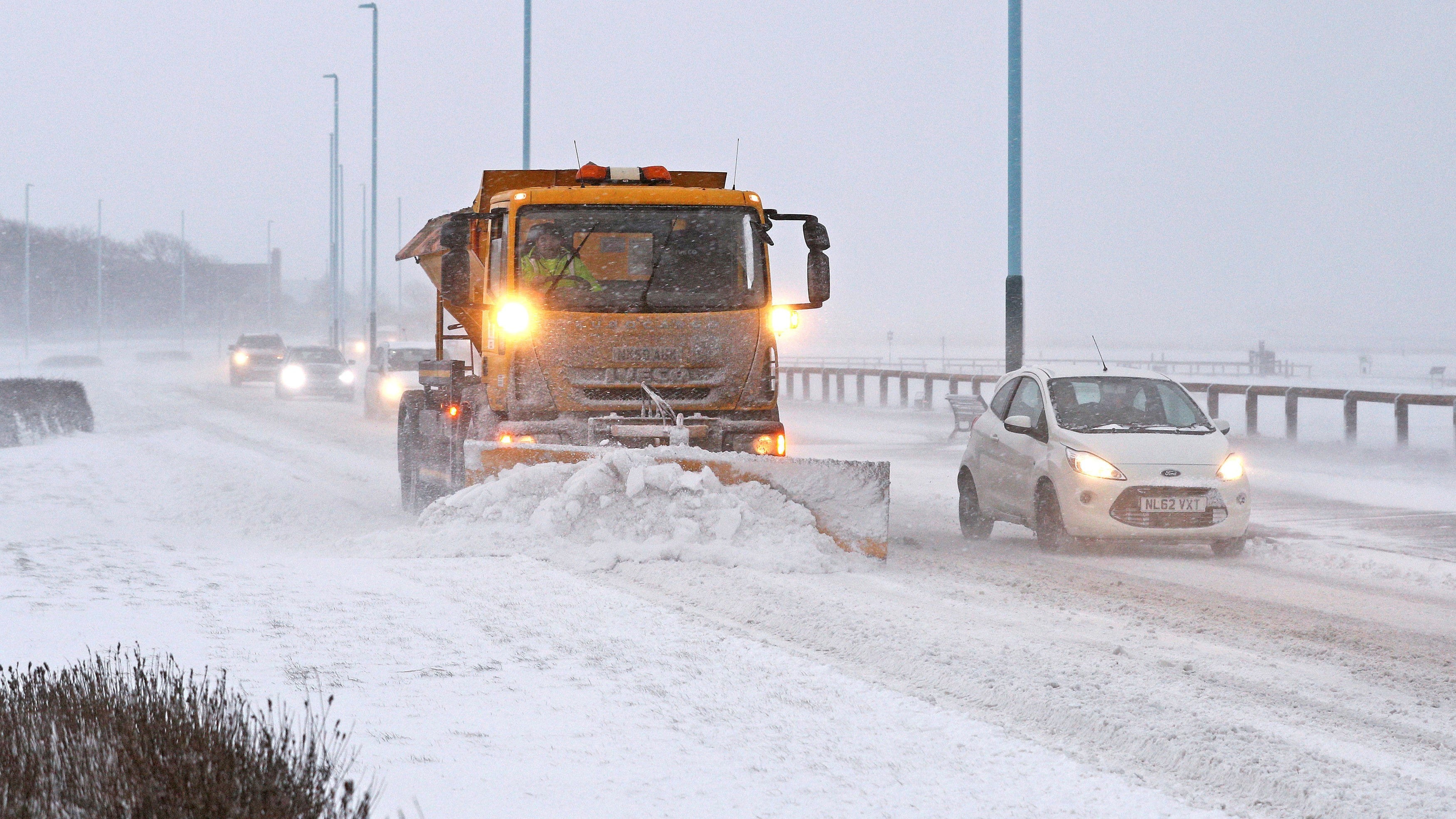 UNITED KINGDOM OUT NO SALES NO ARCHIVE PHOTOGRAPH CANNOT BE STORED OR USED FOR MORE THAN 14 DAYS AFTER THE DAY OF TRANSMISSION
Britain Europe Weather 
Snow ploughs clear drifts from a road in Whitley Bay, north east England, Wednesday Feb. 28, 2018. Britain, which is buffered by the Atlantic Ocean and tends to have temperate winters, saw heavy snow in some areas that disrupted road, rail and air travel and forced hundreds of schools to close. (Owen Humphreys/PA via AP)