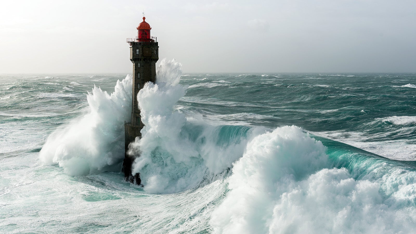 This image was taken during winter 2016 when the Storm Ruzica arrived on the west coast of France. The waves were more than 15m high.We can see a beautiful lighthouse striked by a huge wave.It was in Ouessant, Jument lighthouse.