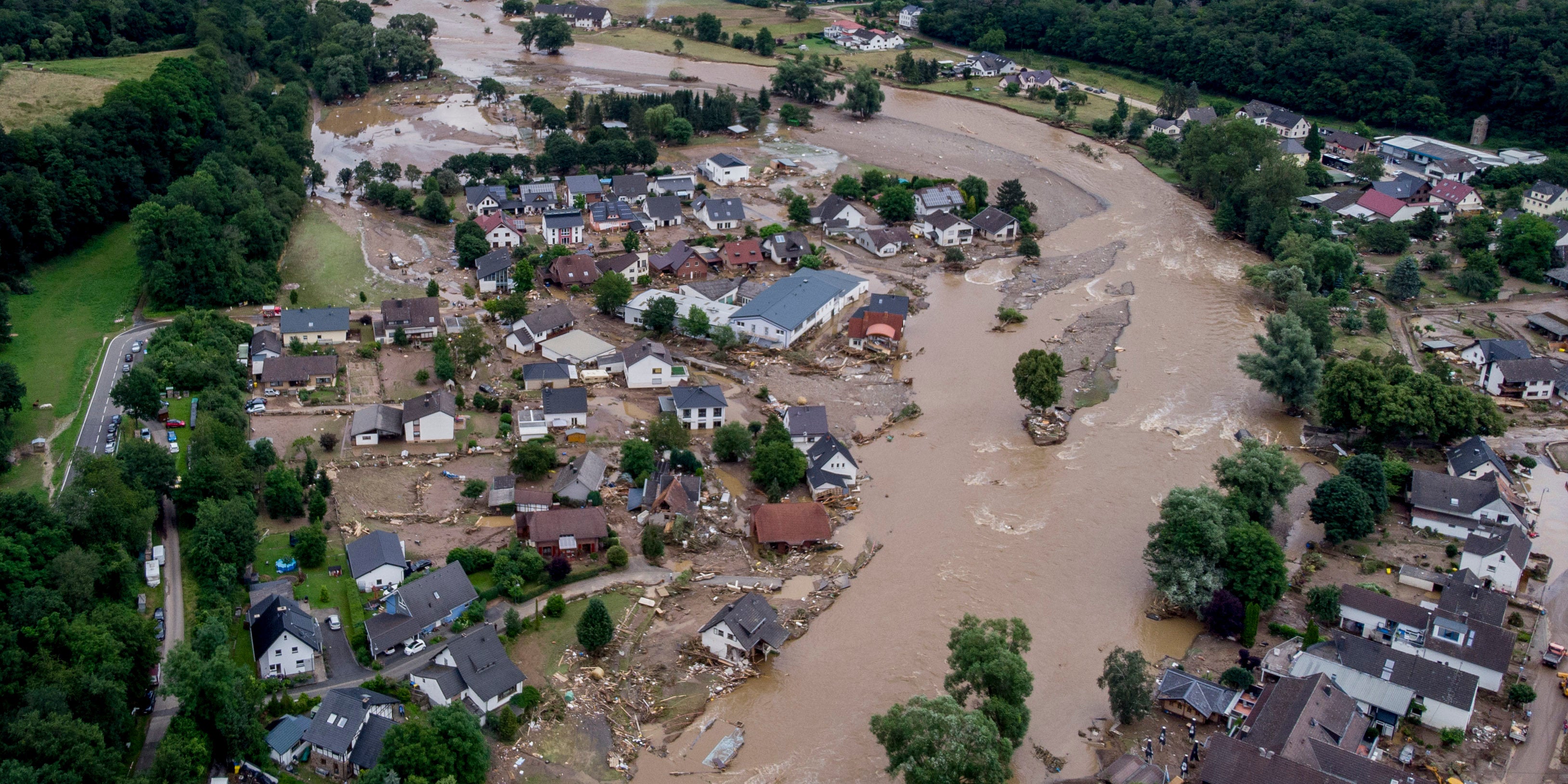 FILE - In this July 15, 2021 file photo the Ahr river floats past destroyed houses in Insul, Germany. Remains of a person missing since devastating floods in western Germany more than two years ago have been found near the mouth of the small Ahr river, which in the summer of 2021 turned into a raging torrent, police said Tuesday, Oct. 31, 2023. (AP Photo/Michael Probst, file)