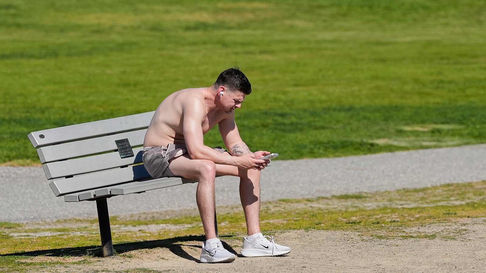 A man rests on a bench while visiting Shoreline Park in Mountain View, Calif., Monday, March 16, 2026. (AP Photo/Godofredo A. V&aacute;squez)