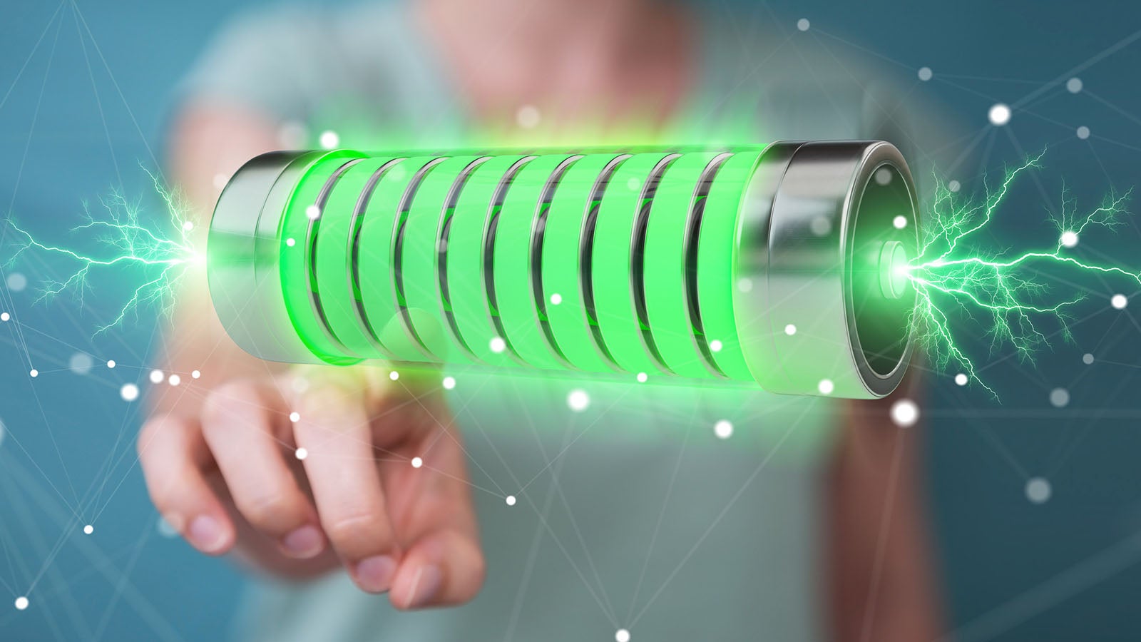 Businessman on blurred background using green battery with lightnings 3D rendering