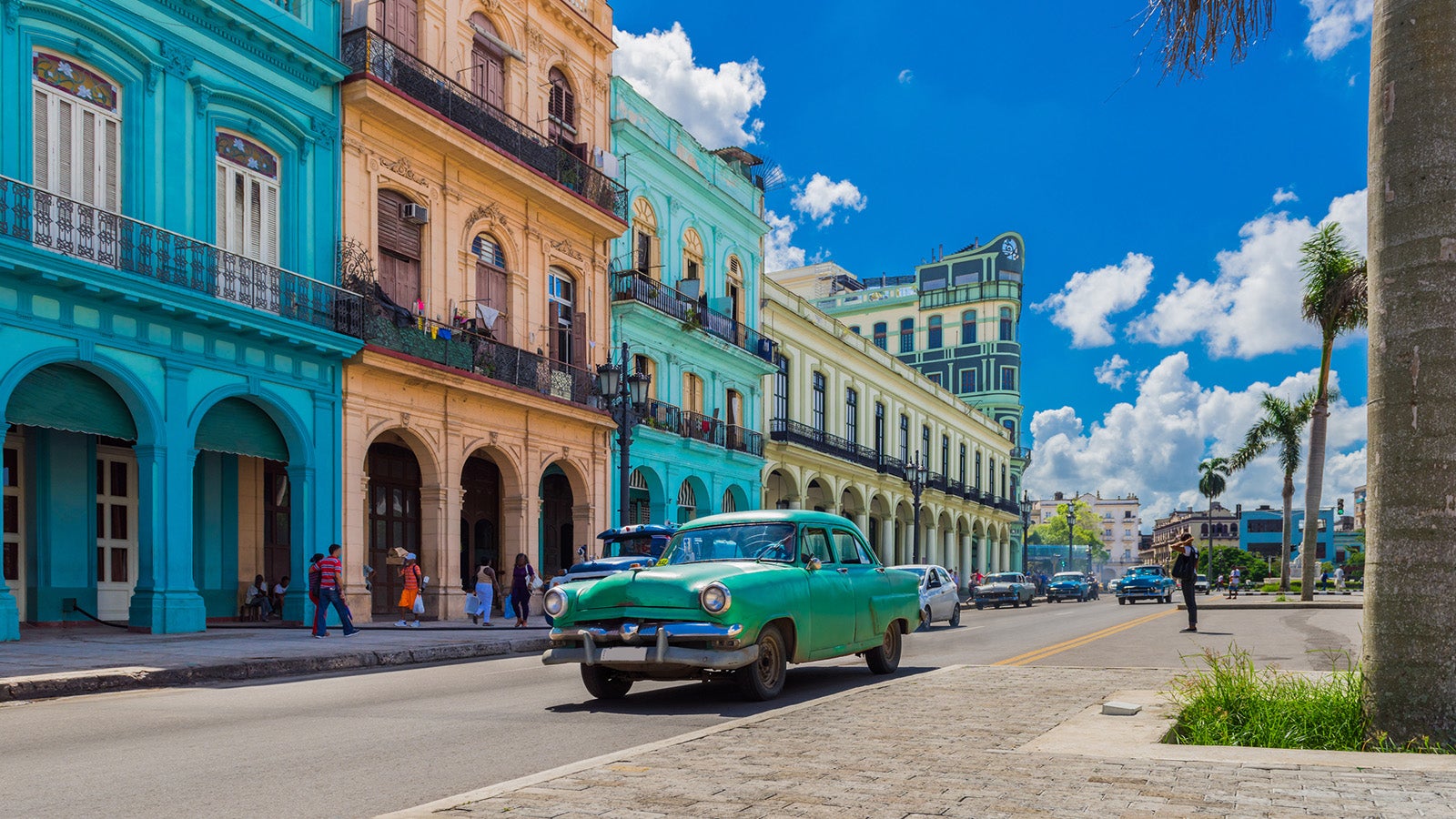 Cityscape with american green vintage car on the main street in Havana City Cuba - Serie Cuba Reportage