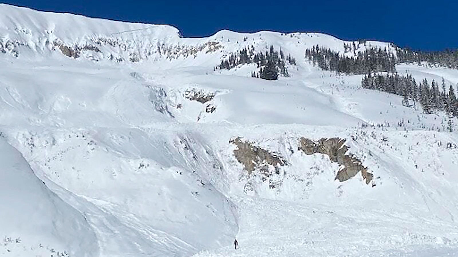 This photo provided by the Colorado Avalanche Information Center shows the aftermath of an avalanche on Saturday, March 18, 2023, near Marble, Colo. A Colorado skier has been killed and two other people were injured after getting caught in a massive backcountry avalanche in western Colorado. (Colorado Avalanche Information Center via AP)