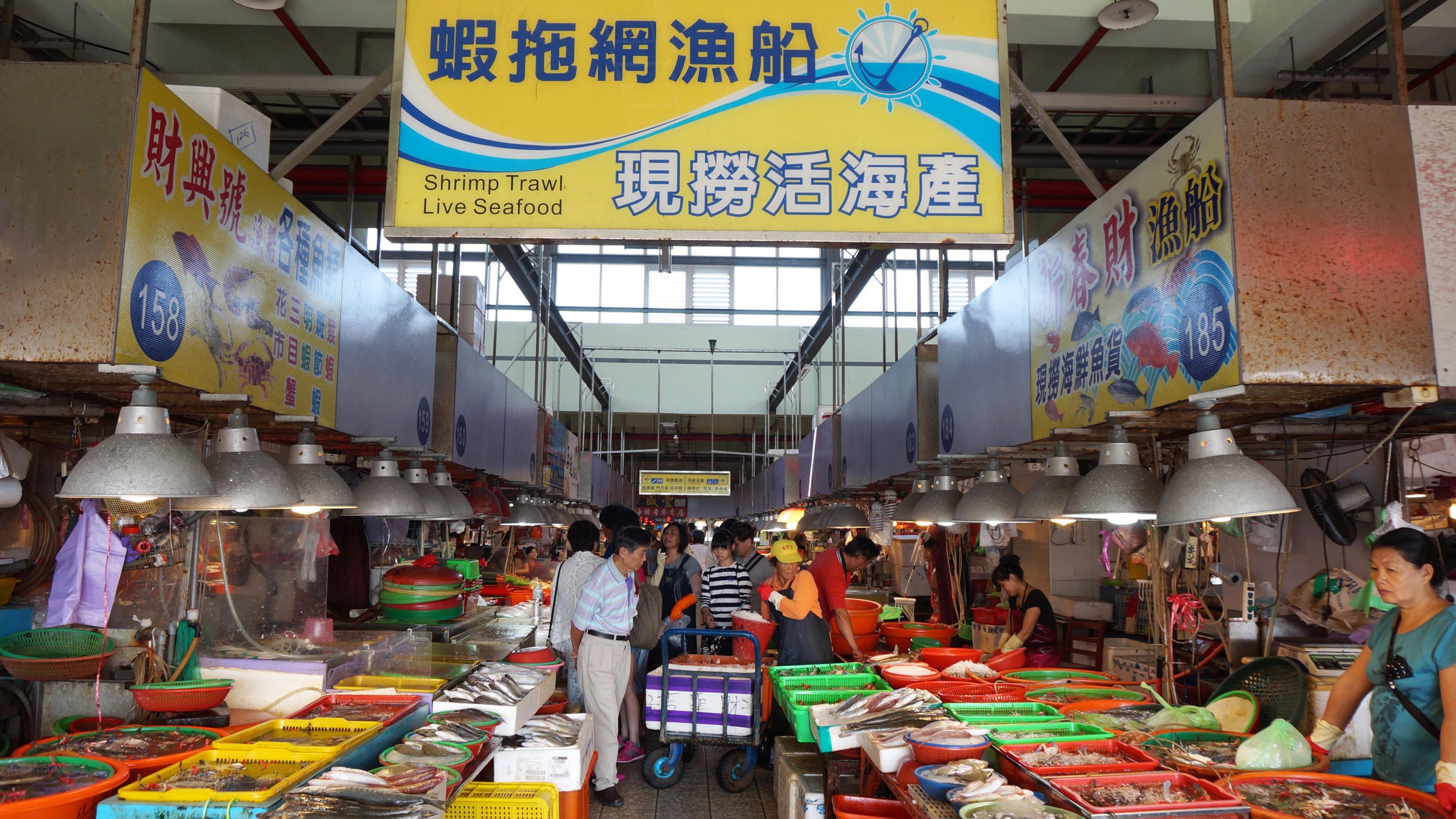 Donggang, Taiwan- Nov 22, 2014: Shoppers visit the famous seafood market in Donggang, Taiwan. Dong Gang Seafood Market is near Kaohsiung City and offers the freshest seafood in Taiwan