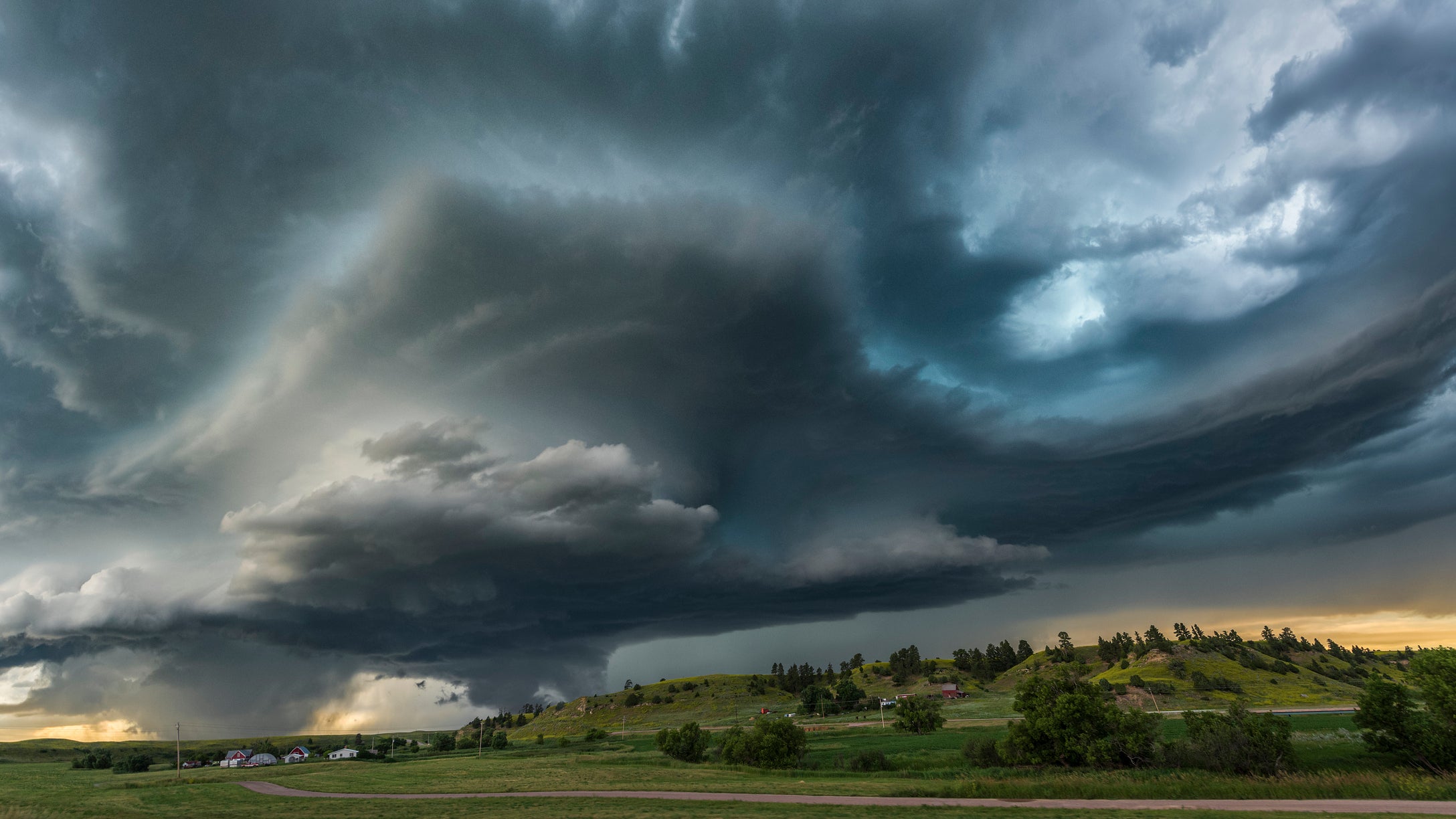 Extreme weather with an Arcus shelf cloud on the front of a severe warned thunderstorm moving over Wyoming farmland near the Black Hills, USA.