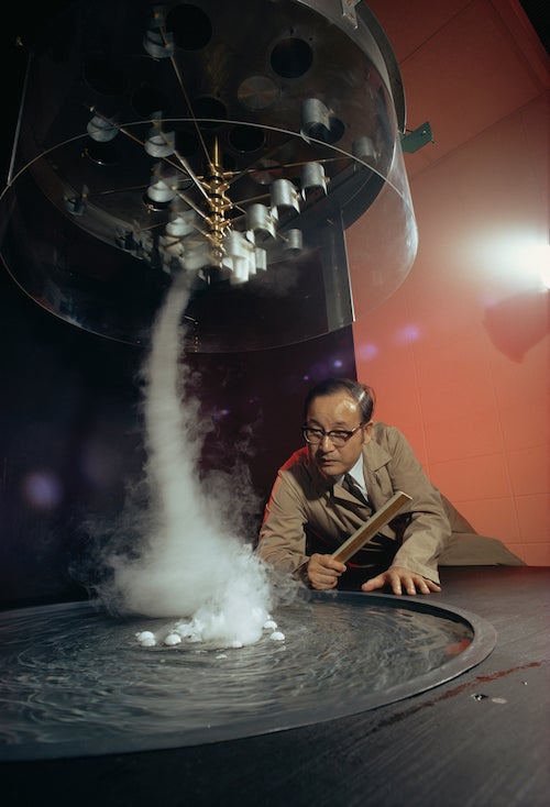 Ted Fujita studies a vortex from a tornado generator in his lab at the University of Chicago