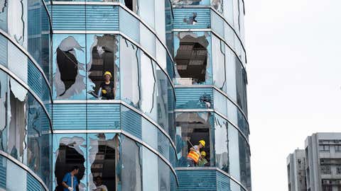 Super typhoon Mangkhut caused great damaged on a commercial building in Hong Kong.
The super typhoon Mangkhut has passed next to Hong Kong on the 16th September causing large scale damages around the city, there are 432 people injured due to the storm with 2 still in critical condition. (Miguel Candela/SOPA Images/LightRocket via Getty Images)